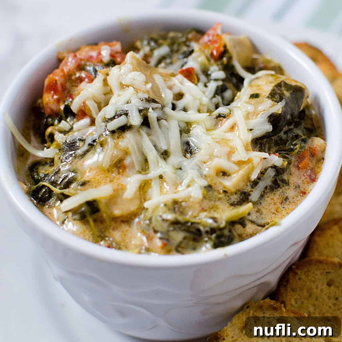 Creamy Slow Cooker Sun Dried Tomato Spinach Artichoke Dip 1 featured 115023