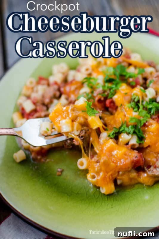 A delectable Crockpot Cheeseburger Casserole served over a vibrant green plate, showcasing a hearty mix of pasta, melted cheese, and seasoned ground beef.