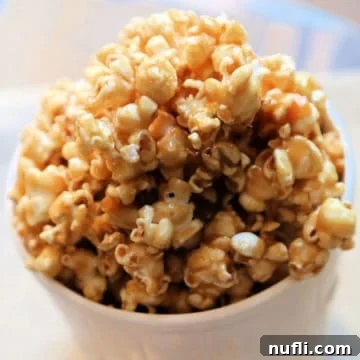 Salted Caramel Popcorn in a white popcorn tub