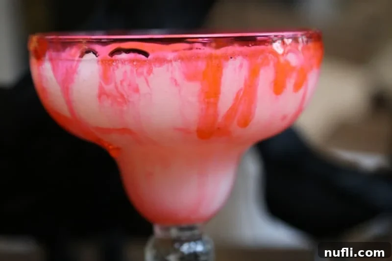 Bloody colada drink in a margarita glass