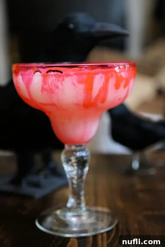 fake blood dripping on the side of a margarita glass