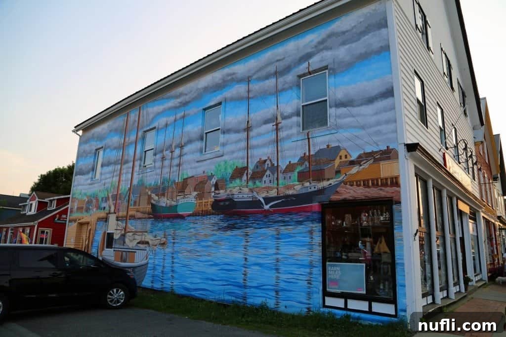 Boat and harbor mural on the side of a building in St. Andrews by the Sea
