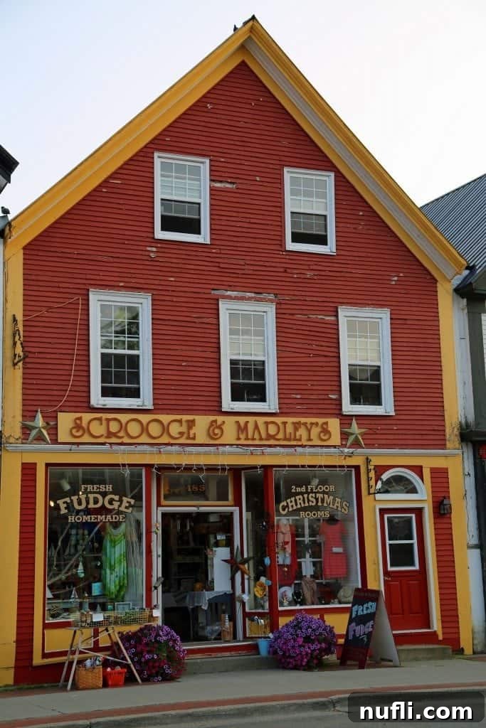 Scrooge & Marley's Store in Saint Andrews by the Sea, featuring a tempting sign for fresh fudge and traditional storefront.