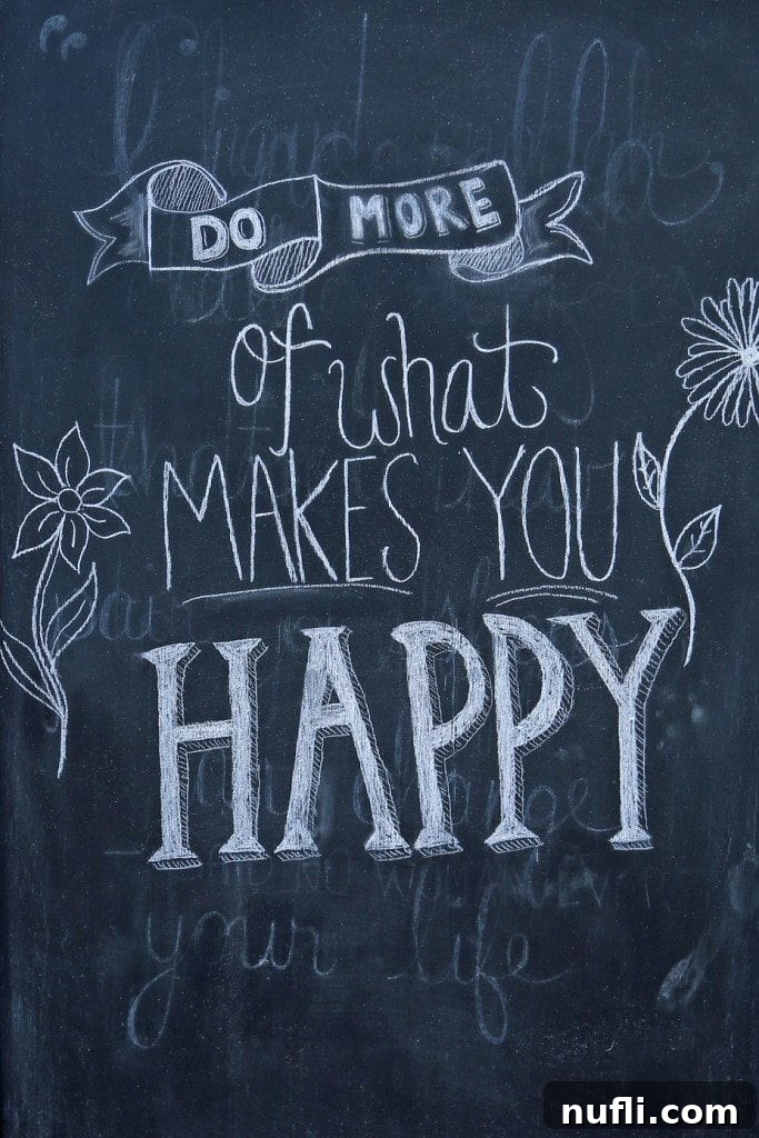 Inspiring chalkboard message 'Do More of What Makes You Happy' in Saint Andrews by the Sea, reflecting the town's positive vibe.