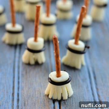 witches broom pretzel sticks lined up on a blue background