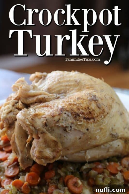 Close-up of cooked Crockpot turkey breast with carrots, celery, and onions, sliced on a white platter.