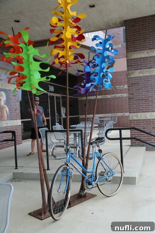 Sculpture with a bike below it, part of the 50 sculptural bike racks in Fort Wayne