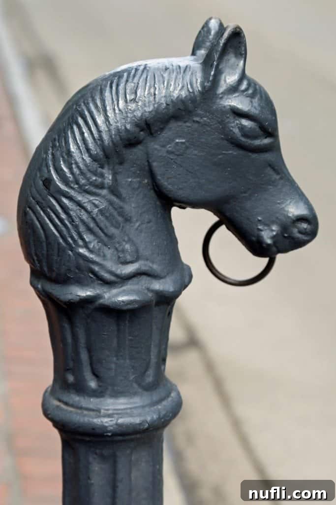 A historic sidewalk in the French Quarter New Orleans, flanked by charming buildings with intricate details.