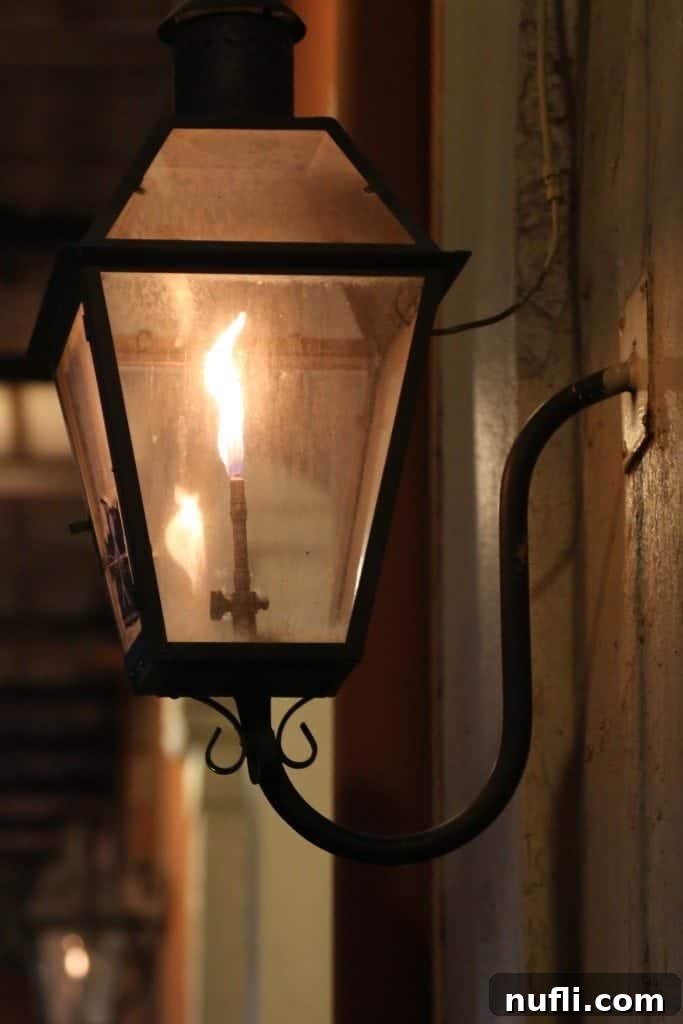 An ornate street lamp design in the New Orleans French Quarter, highlighting the intricate historical details.