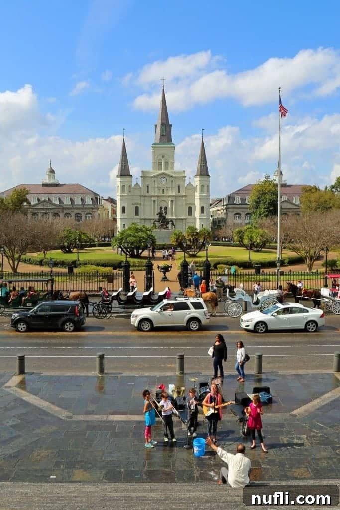 Energetic street band performing live music in front of Jackson Square New Orleans, drawing a crowd.