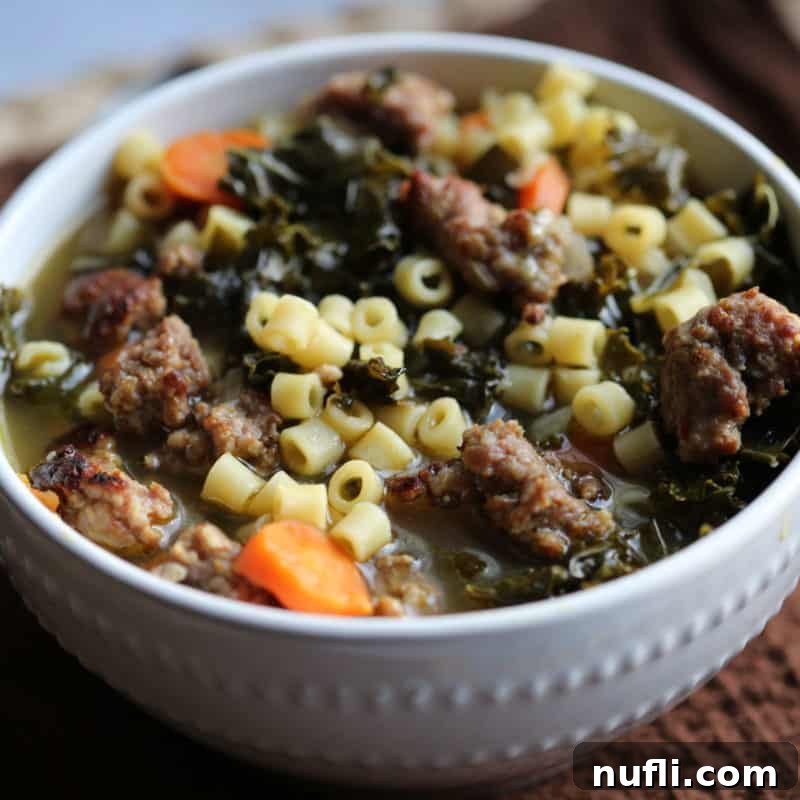 Crockpot Italian Wedding Soup in a white bowl on a brown cloth napkin