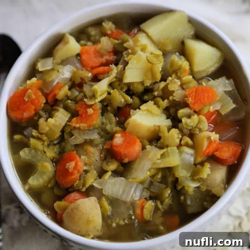 Split Pea Soup with carrots in a white bowl