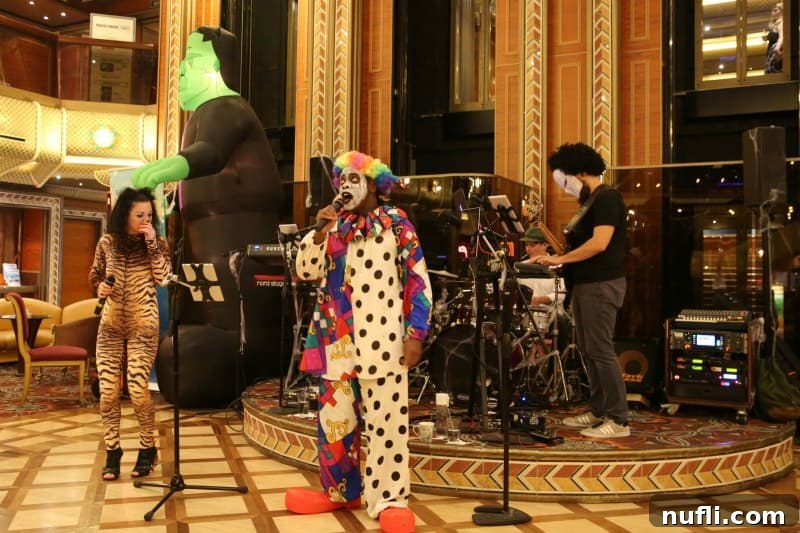 A lively scene on a Carnival Halloween Cruise with a costumed clown singing next to a woman in a striking leopard print cat suit, highlighting the diverse entertainment.