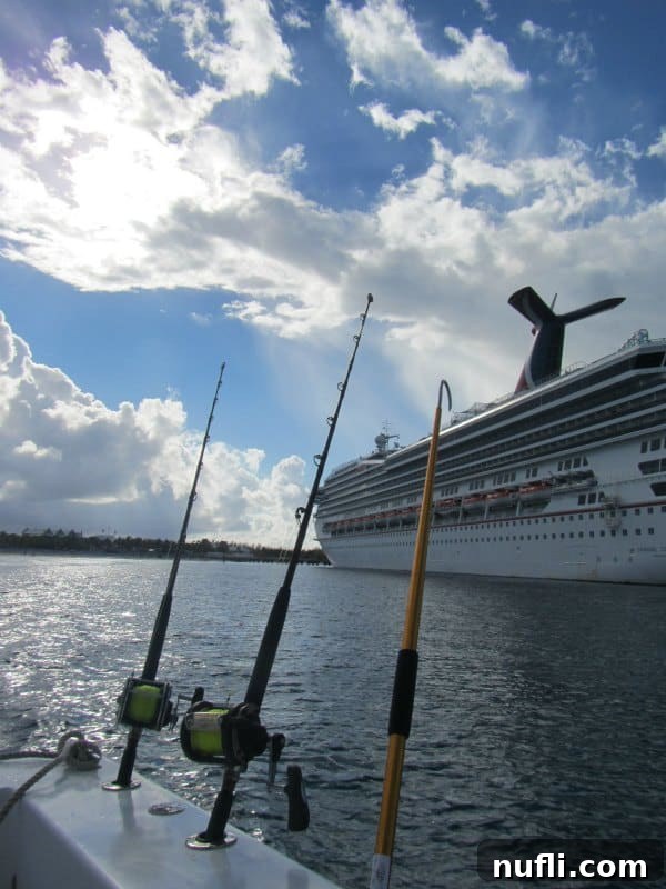 Grand Turk Deep Sea Fishing: Hooking Adventure, Landing Joy 3 fishing boat near a Carnival Ship