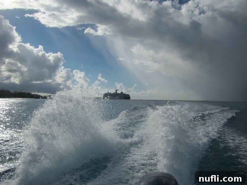 Grand Turk Deep Sea Fishing: Hooking Adventure, Landing Joy 4 Looking behind a boat to the Carnival Cruise Ship
