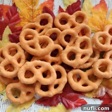 Pumpkin Spice Pretzels piled on fake leaves