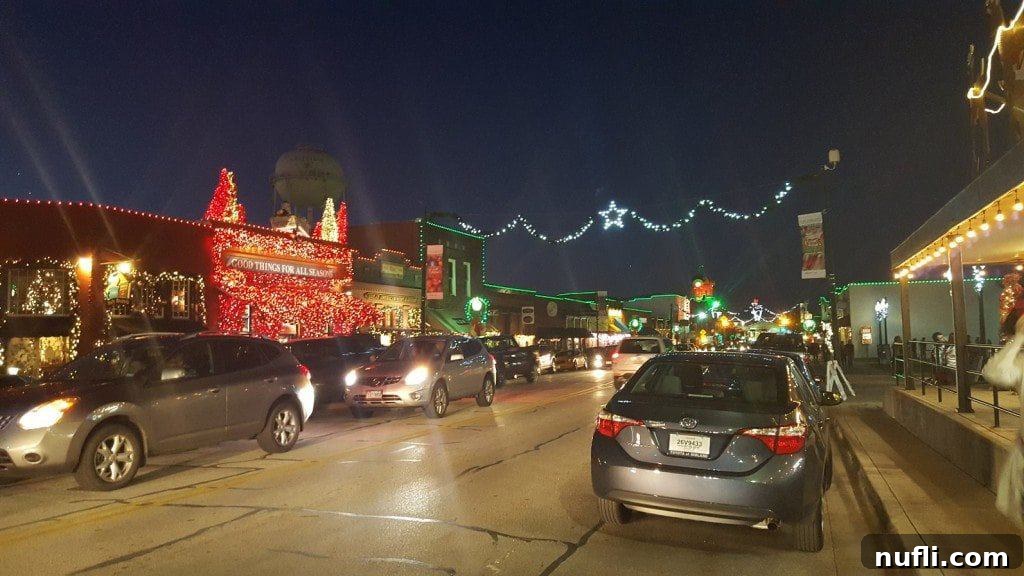 Grapevine's Historic Main Street illuminated at night with festive Christmas lights.