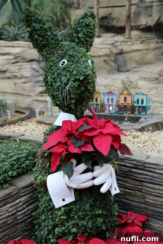 Christmas at the Gaylord Texan in Grapevine, Texas 5 bunny topiary holding poinsettias