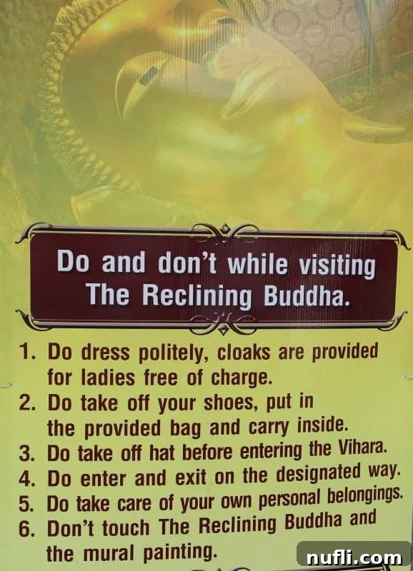 Rules and regulations poster for visitors at Wat Pho Reclining Buddha Temple, emphasizing respectful behavior and dress code.