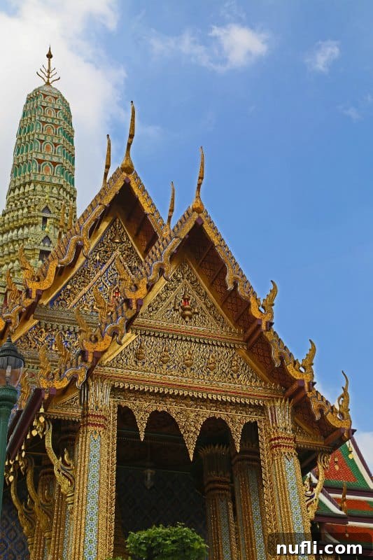 Bangkok's Grand Palace: Discovering Royal Thailand with Essential Visitor Tips 5 Golden building in the Grand Palace complex, gleaming under the sun