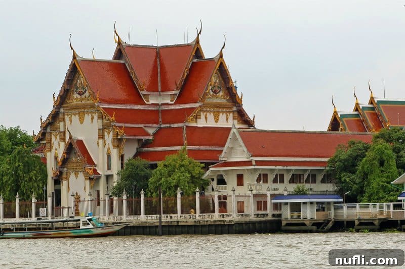 Traditional riverside architecture along the Chao Phraya River in Bangkok