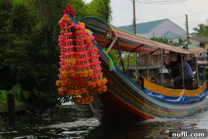 A traditional longtail boat on the tranquil waters of the Chao Phraya River, Bangkok