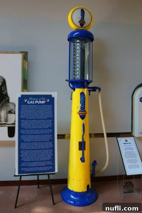 Historic gas pump in blue and yellow, a vintage fuel station display