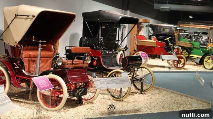 Historic Model T era cars in a museum setting
