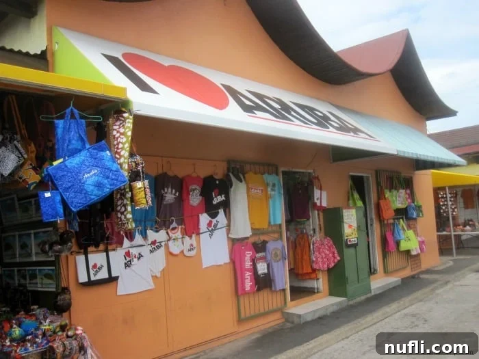 Aruba Cruise Highlights 9 I heart Aruba on the awning over a gift shop with t-shirts hanging outside
