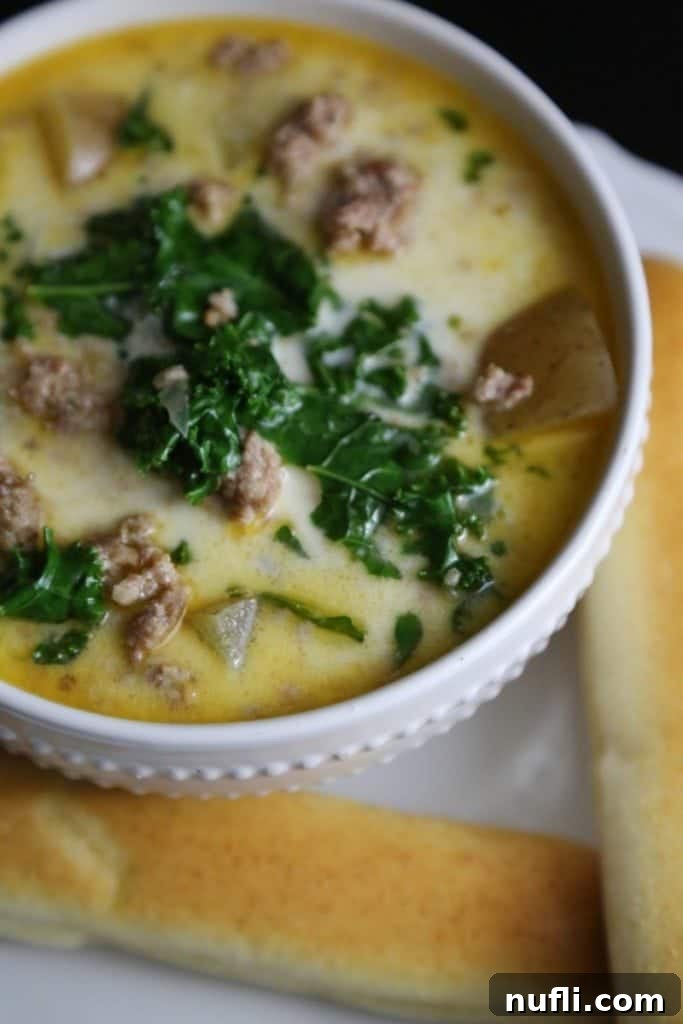 Another appealing shot of the Crock Pot Copy Cat Olive Garden Zuppa Toscana Soup Recipe, ready to be served, highlighting its comforting appeal.
