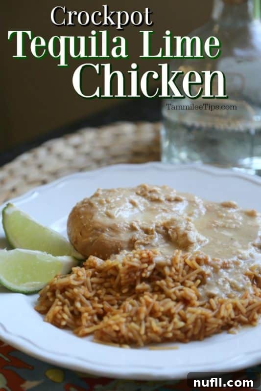 Crock Pot Tequila Lime Chicken served over fluffy white rice, garnished with fresh lime slices and vibrant cilantro, presented on a pristine white plate.