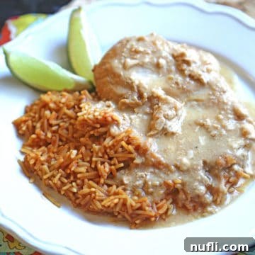 slow cooker tequila chicken next to rice and limes