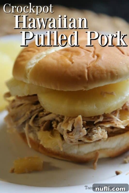 Succulent Hawaiian Slow Cooker Pulled Pork 2 Crockpot Hawaiian Pulled Pork over a bun with pineapple slices and pulled pork
