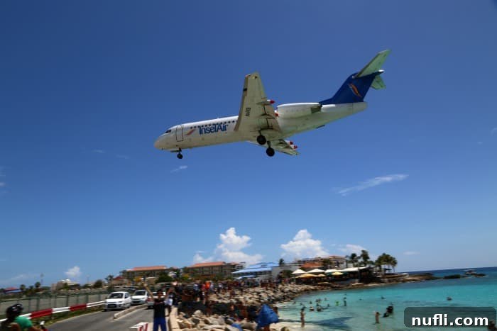 Insel Air plane coming in over Maho Beach 