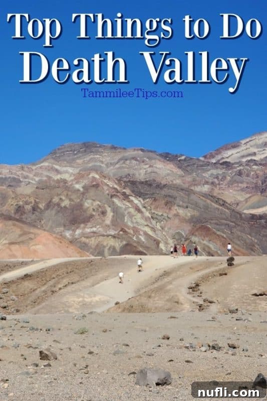 Unforgettable Death Valley Experiences 2 Top Things to do Death Valley over people walking on a sand trail with mountains behind them.