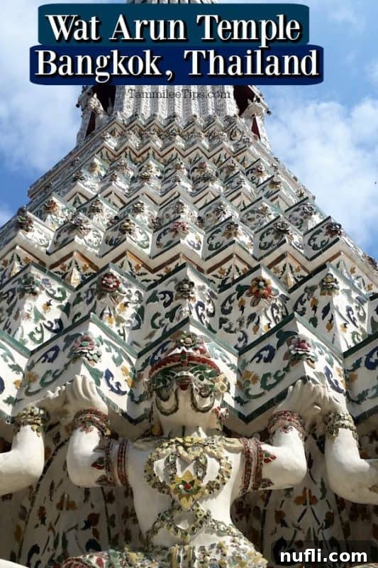 Panoramic view of Wat Arun, the Temple of Dawn, rising majestically against the Bangkok skyline
