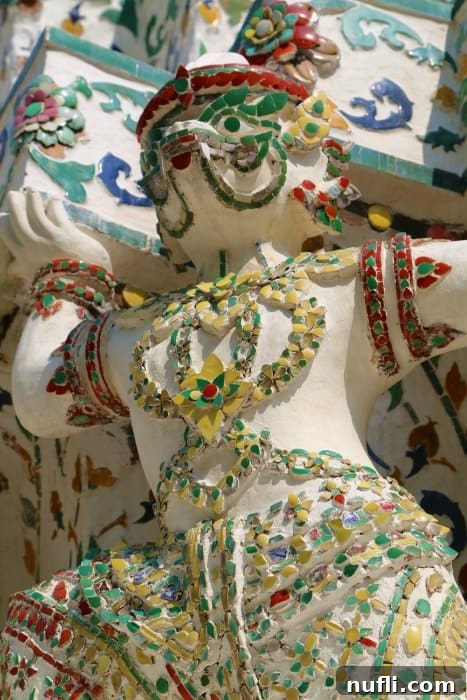 Close-up of the intricate porcelain mosaic ornamentation on Wat Arun's central prang