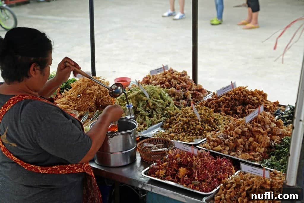 An array of delicious food prepared and ready for sale at the bustling Sunday Market, Ko Kret, Thailand