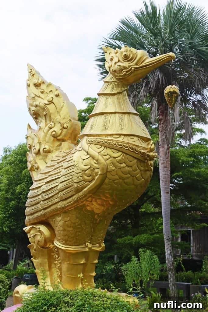 Golden chicken figurine on display at the Sunday Market, Ko Kret, Thailand