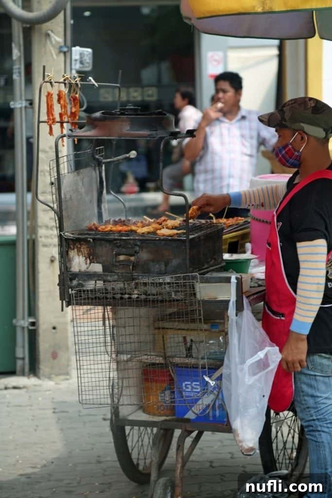 Colorful food cart displaying delicious treats at the Sunday Market, Ko Kret, Thailand