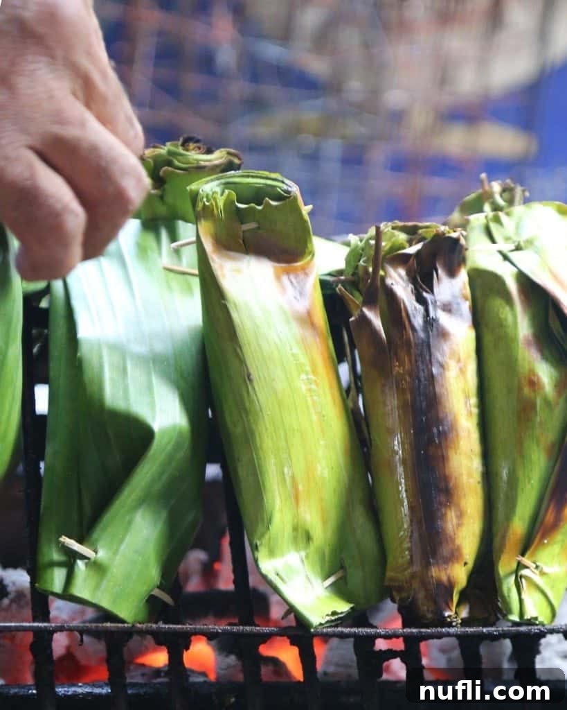 Cooking over coals at a food stall, Sunday Market, Ko Kret, Thailand
