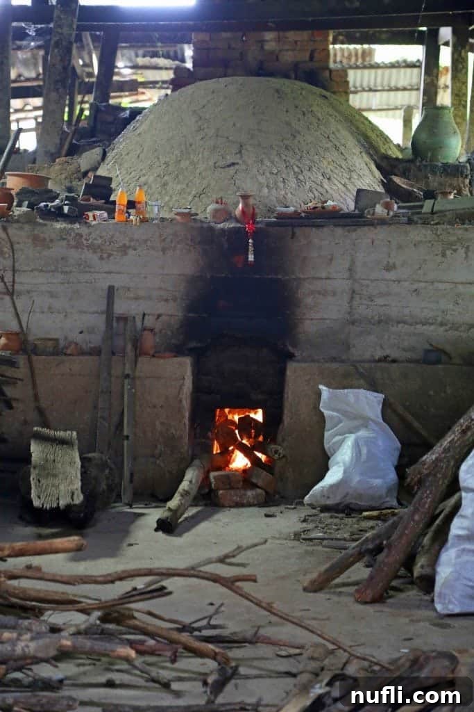 Open fire cooking at a stall in the Sunday market, Ko Kret, Thailand