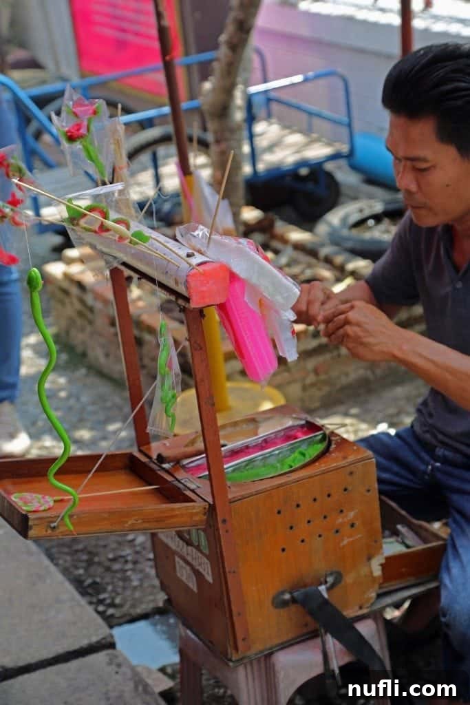 Skilled worker at a pottery stall in the Sunday Market, Ko Kret, Thailand