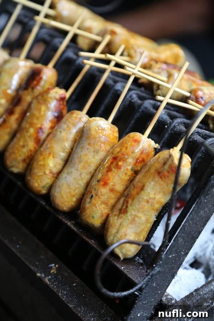 Delicious grilled sausage at the vibrant Sunday Market in Ko Kret, Thailand