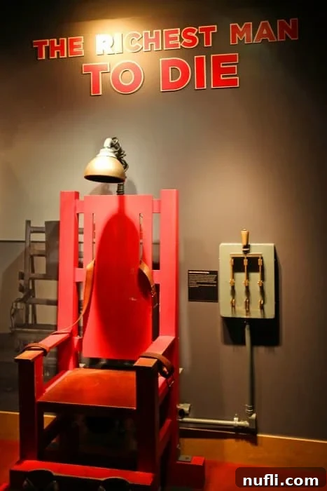 An exhibit panel detailing the life and death of a notorious historical figure, 'The Richest Man to Die,' at The Mob Museum