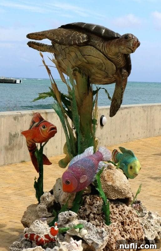 Sculpture of a turtle and tropical fish in Amber Cove
