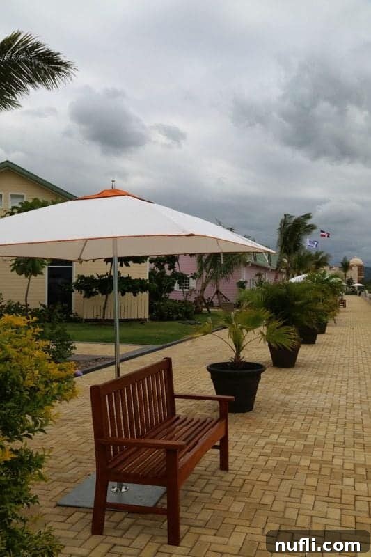 Bench with an umbrella over it at Amber Cove
