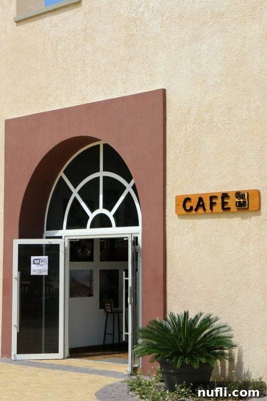 Cafe sign next to an open door in Amber Cove