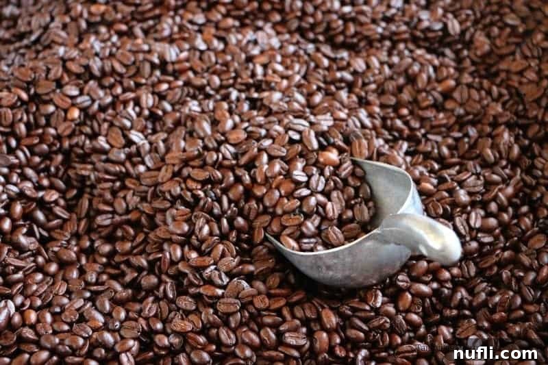 Coffee beans with a scoop in a burlap bag