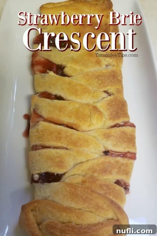 Strawberry Brie Crescent over a crescent roll on a white platter 